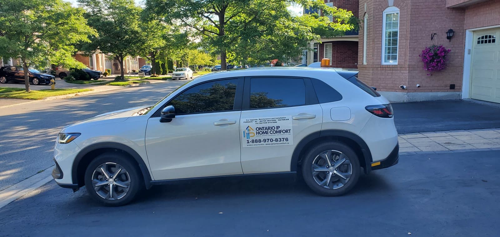 An Ontario IP Home Comfort branded service vehicle parked at a Greater Toronto Area home