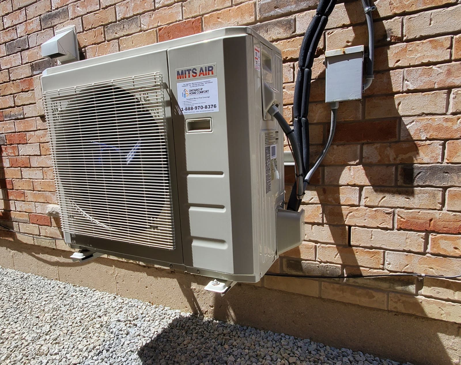 An Ontario IP Home Comfort technician completing a heat pump installation at a GTA home